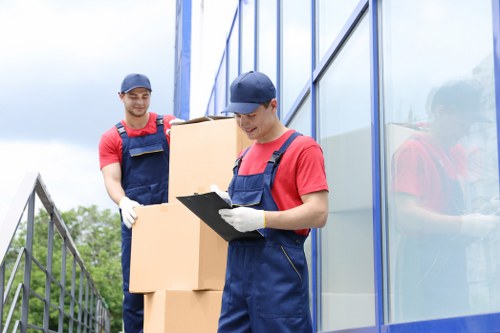 Professional flat removals in Winchmorehill with movers handling boxes